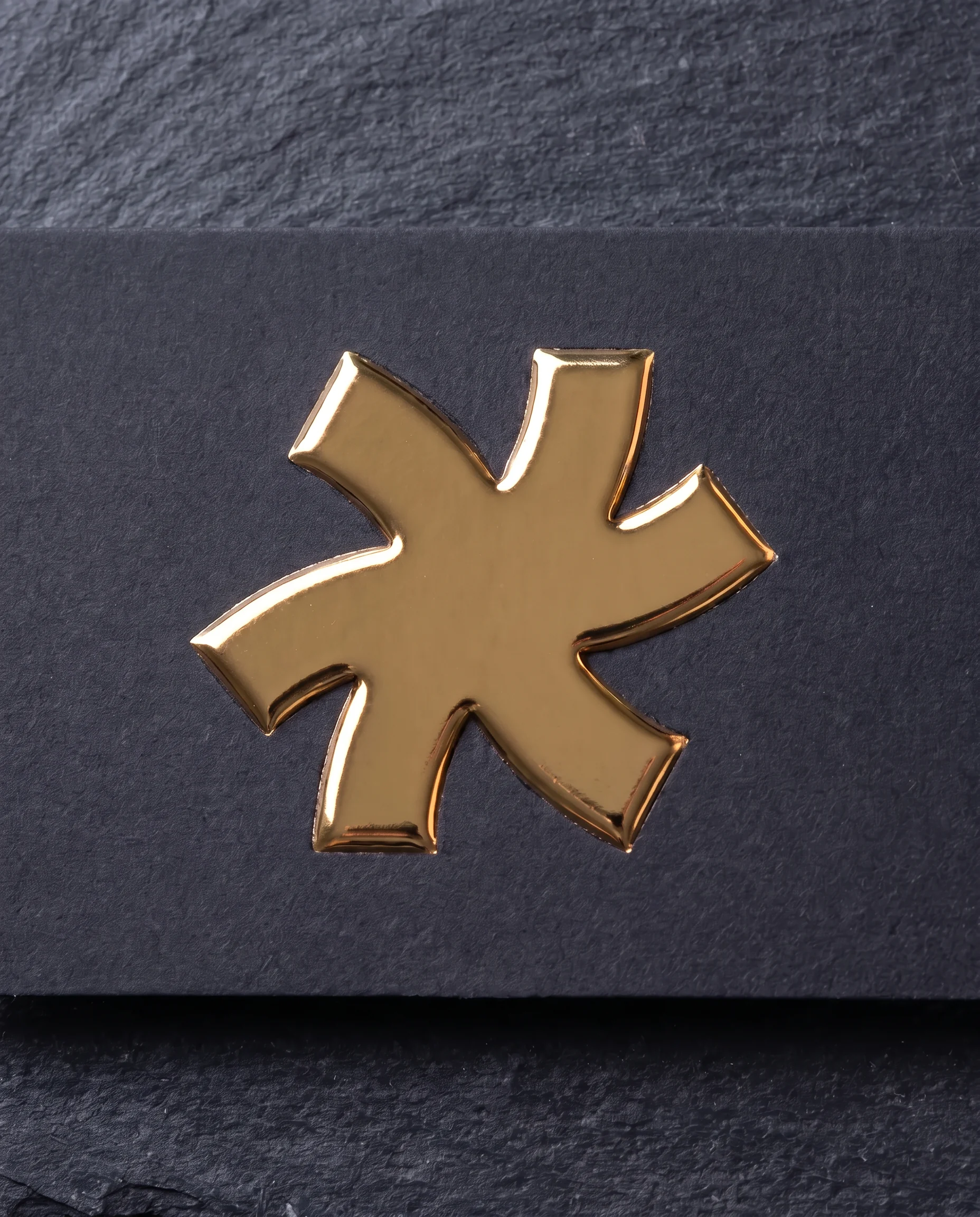 Raised gold foil on soft touch matte